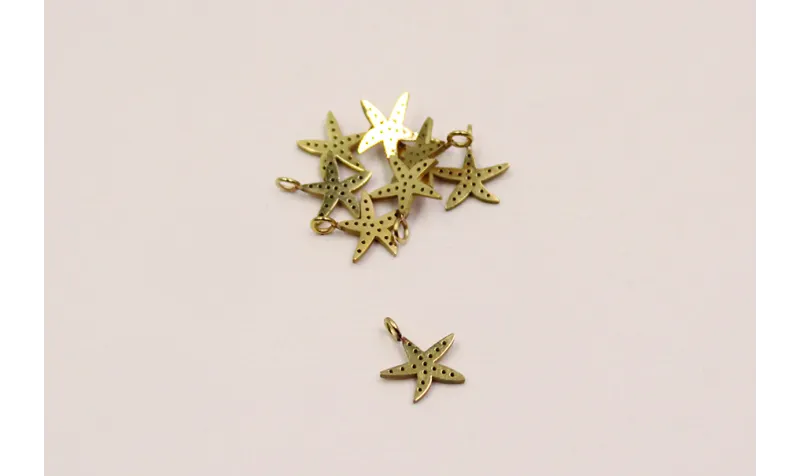 Pieza Estrella mar 9mm diám. A.Inoxidable baño Oro