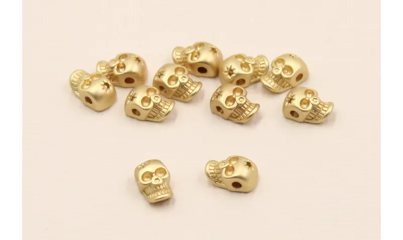 Cuenta Mini Calavera 7,5*5*4mm Dorado Mate