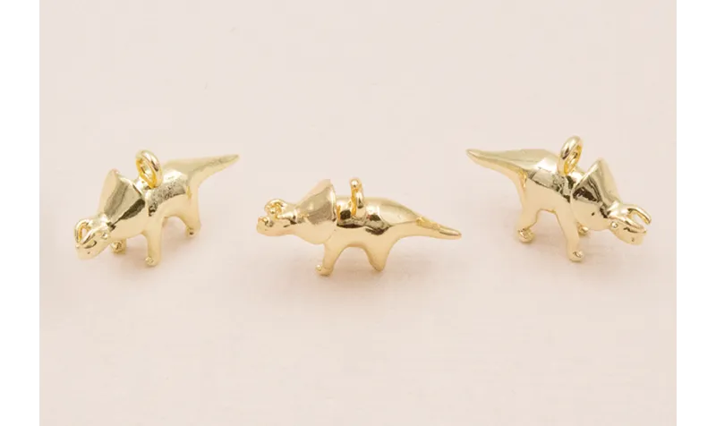 Colgante dinosaurio 15*10mm Oro
