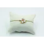Pulsera nudo serpiente en color oro palido con flo