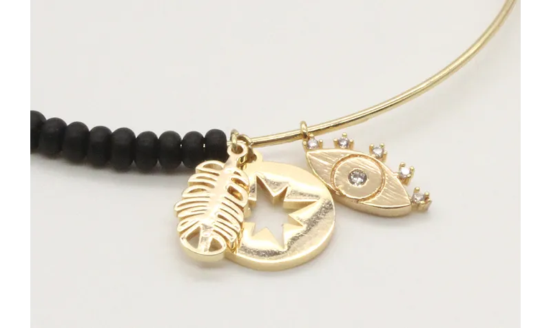 Pulsera rigida corrediza con abalorio negro mate y