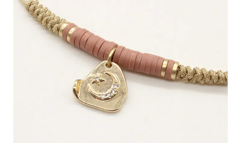 Pulsera nudo serpiente oro palido con lentejuelas 