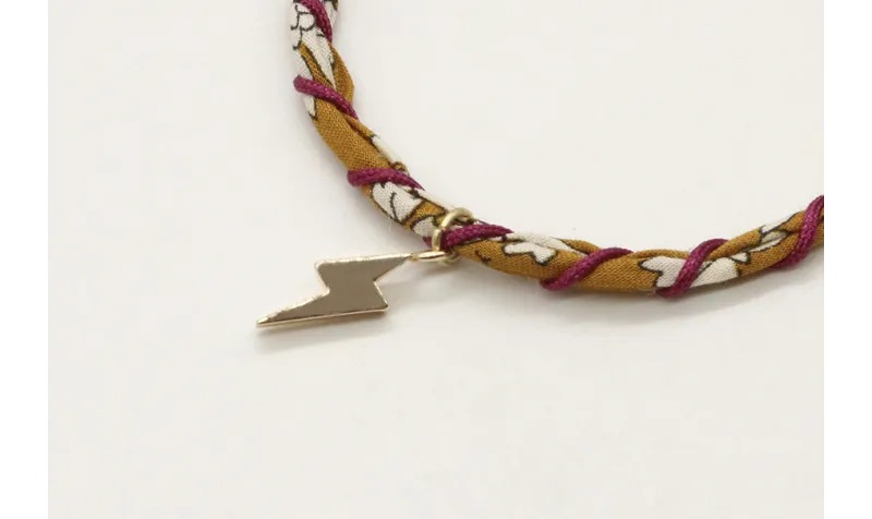 Pulsera rigida forrada con liberty mostaza e hilo 