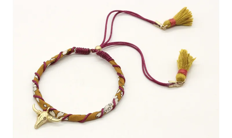 Pulsera rigida forrada con liberty mostaza e hilo 