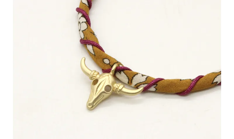 Pulsera rigida forrada con liberty mostaza e hilo 