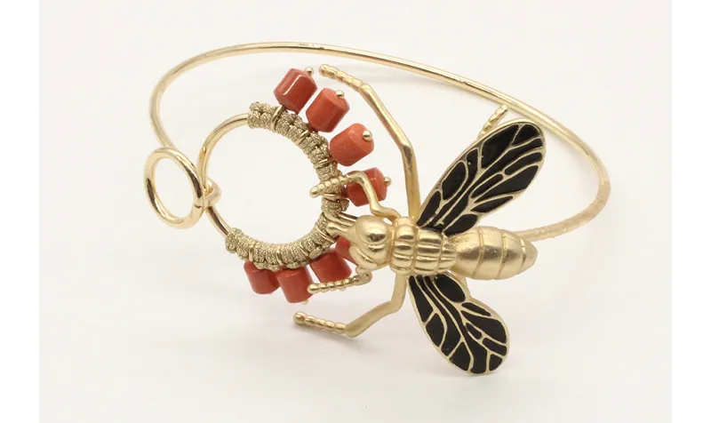 Pulsera rigida doble aro con mosca dorada y negra 