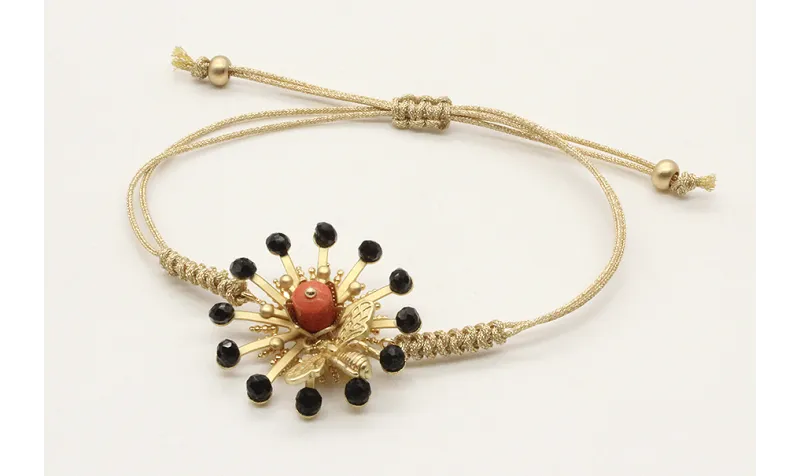 Pulsera nudo serpiente oro palido con sol,casquill