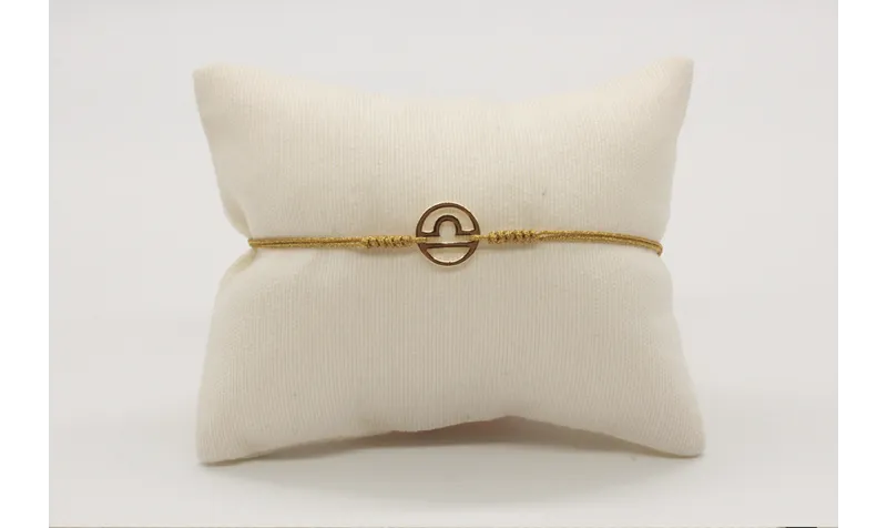 Pulsera nudo serpiente dorado con signo del zodiac