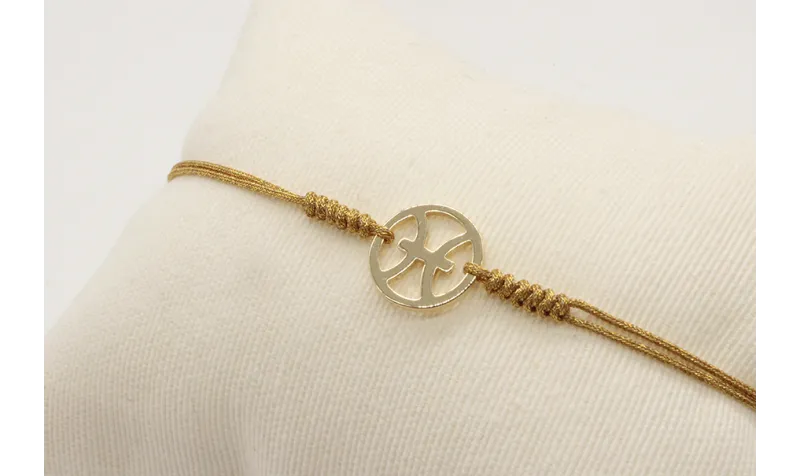 Pulsera nudo serpiente dorado con signo del zodiac