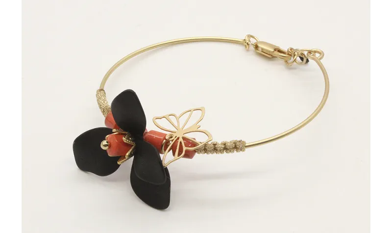 Pulsera rigida con flor esmaltada negra, toneles d