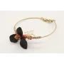 Pulsera rigida con flor esmaltada negra, toneles d