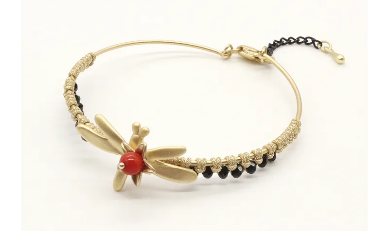 Pulsera rigida macrame oro palido con facetadas ne