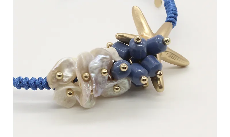 Pulsera nudo serpiente macrame azul con madre-perl