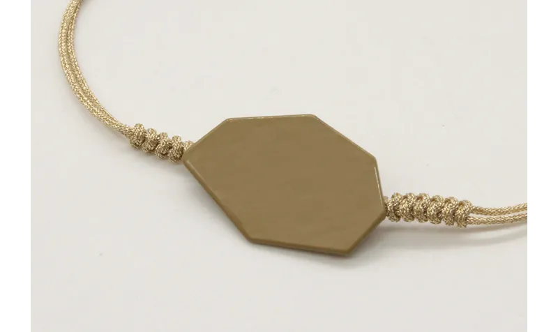Pulsera nudo serpiente oro palido con pieza esmalt