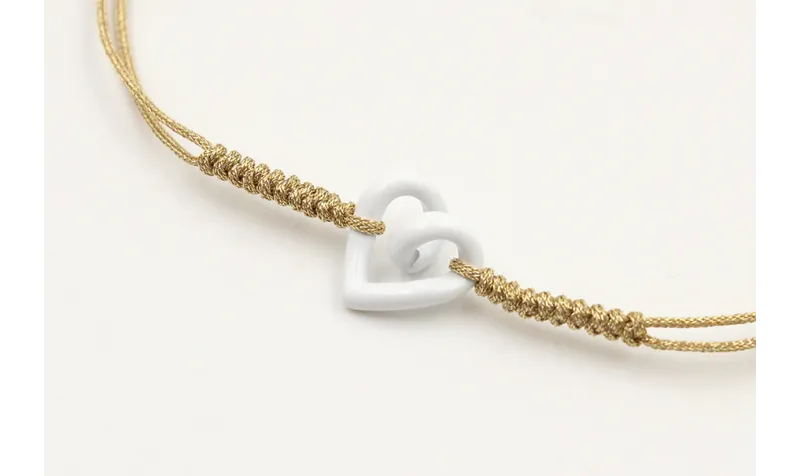 Pulsera nudo serpiente dorado con corazón hueco bl