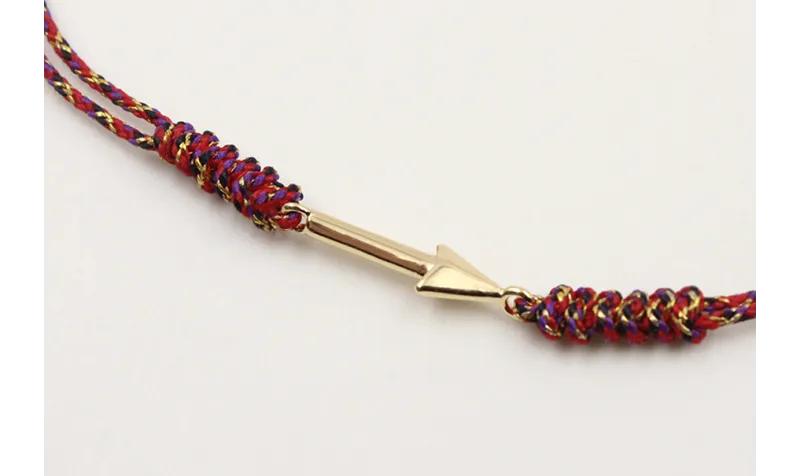 Pulsera nudo serpiente rojo vivo y oro con flecha 