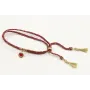 Pulsera trenzada hilo rojo vivo y oro con chapa co