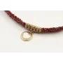 Pulsera trenzada hilo rojo vivo y oro con chapa co