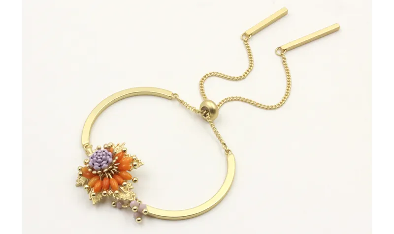 Pulsera semirigida con hoja central oro mate, oval