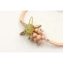 Pulsera semirigida con bolas rositas, estrella oro