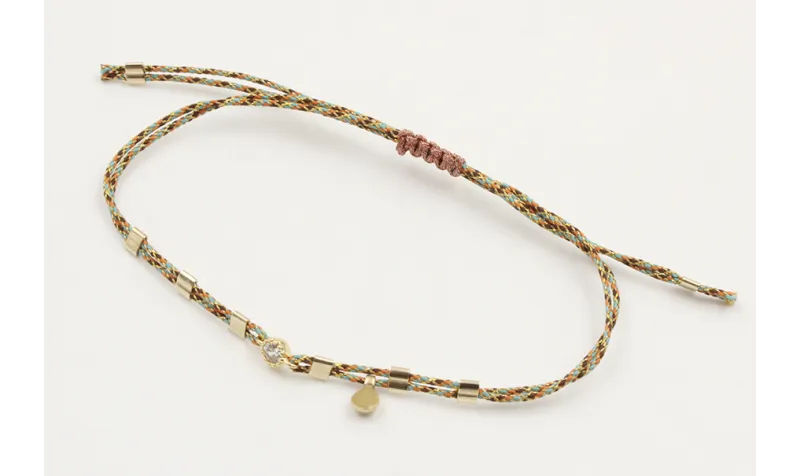 Pulsera macrame rosa,azul y oro con nudo en color