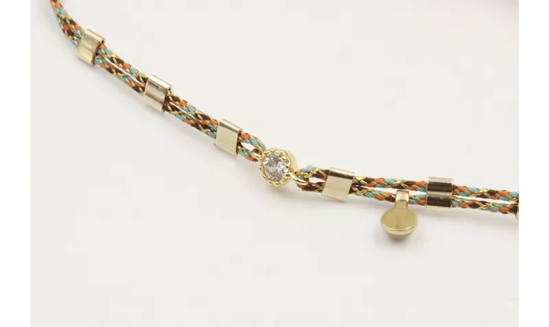 Pulsera macrame rosa,azul y oro con nudo en color