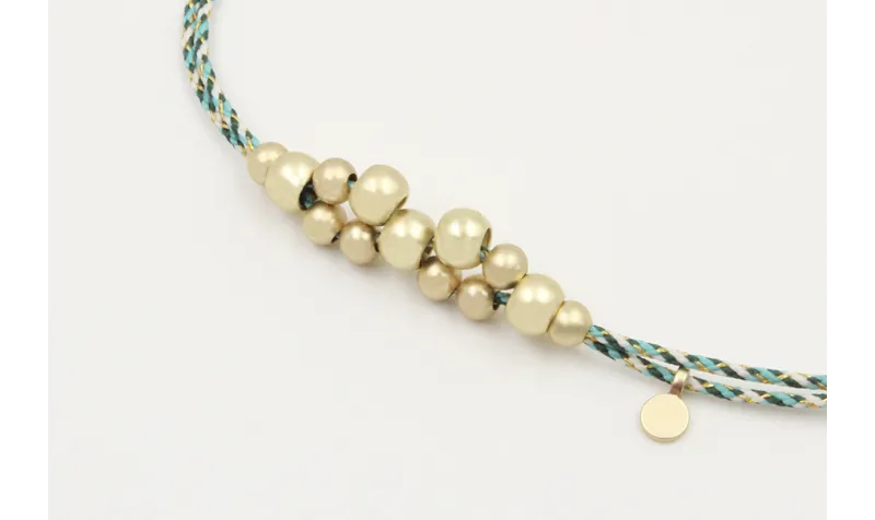 Pulsera macrame azul,gris y oro con nudo macrame p