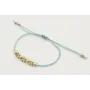 Pulsera hilo macrame menta con  bolas en oro mate.