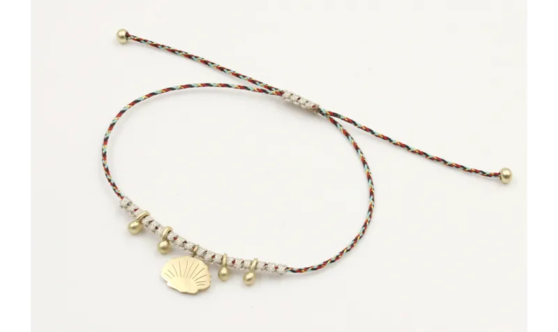 Pulsera hilo macrame azul,rojo y oro con nudo macr