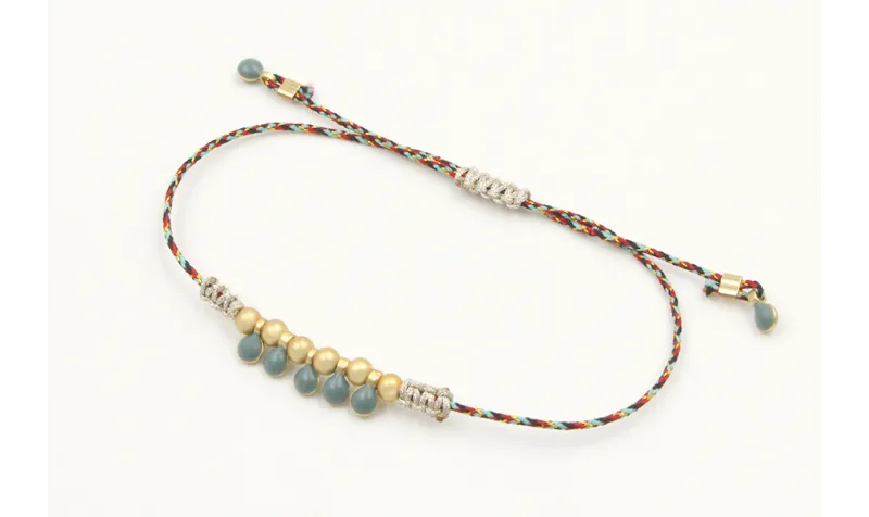 Pulsera hilo macrame azul,rojo y oro con nudo macr