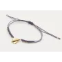 Pulsera macrame morado con bolitas doradas y avión