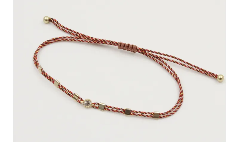 Pulsera hilo granate,oro y microdrusa oro rosa nud