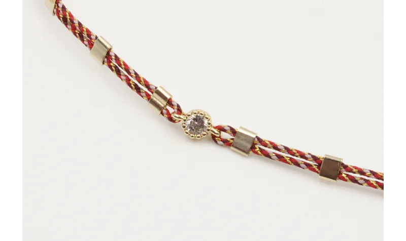 Pulsera hilo granate,oro y microdrusa oro rosa nud