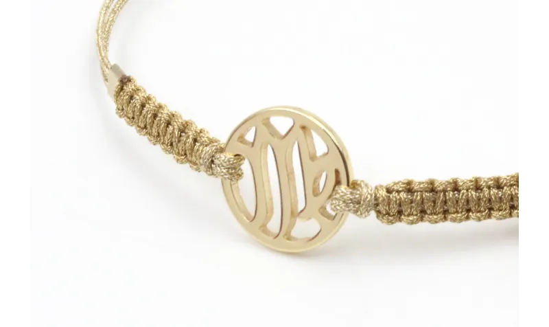 Pulsera hilo macrame oro palido con nudo dorado di