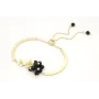 Pulsera semi rigida en oro mate con centro de flor