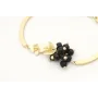 Pulsera semi rigida en oro mate con centro de flor