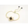 Pulsera semi rigida en oro mate con centro hoja de