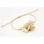 Pulsera nudo serpiente oro pálido con centro hoja 