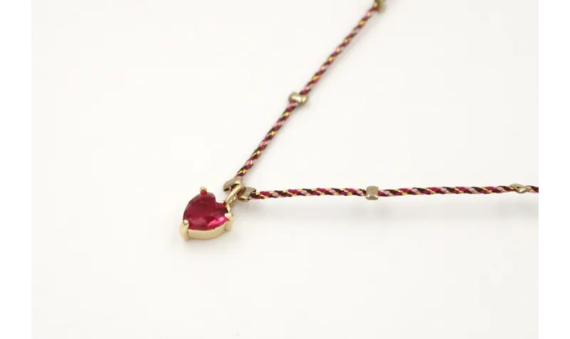 Solitario con hilo micro driza granate,oro con col