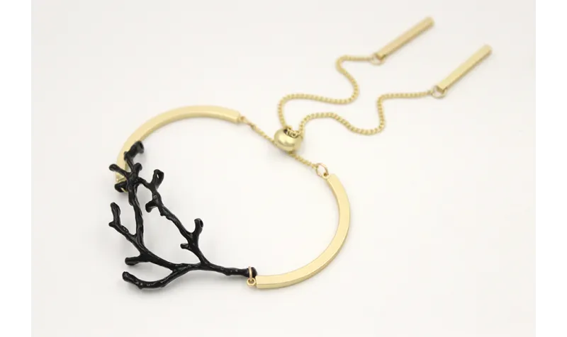 Pulsera semirrigida oro mate con rama de coral esm