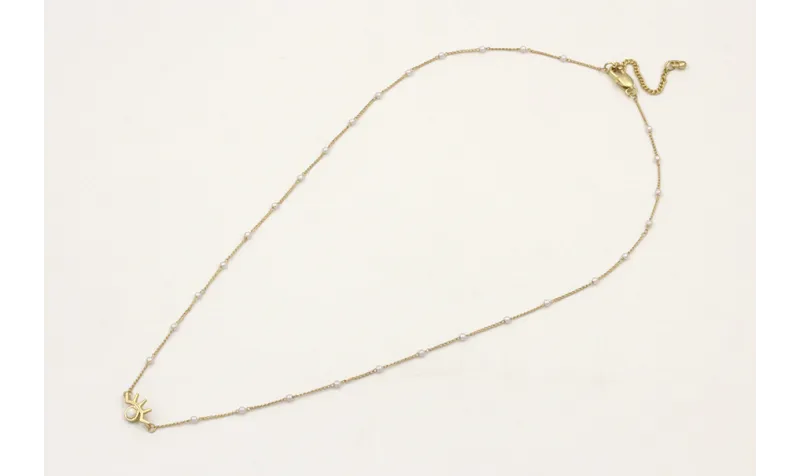 Solitario de cadena con perlas y colgante ojo pest