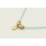 Collar hilo azul con colgante lamina labrada y rue