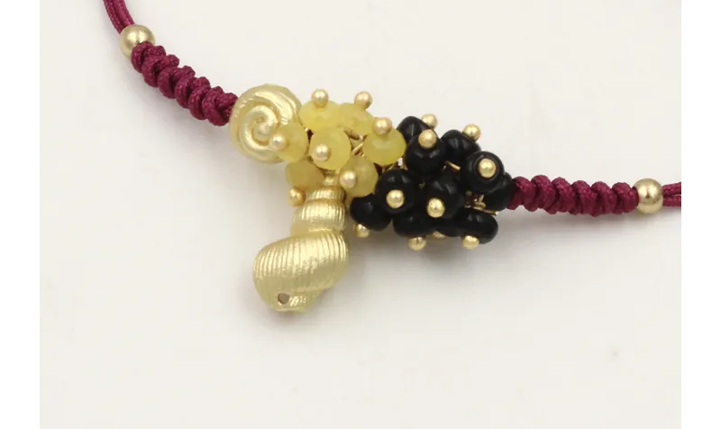 Pulsera hilo granate nudo serpiente con caracolill