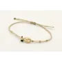 Pulsera hilo dorado palido con tubitos aplastados 
