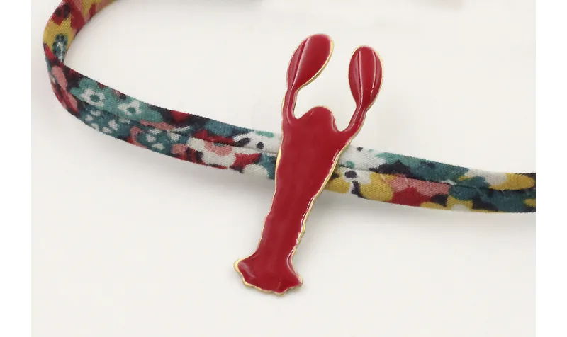 Pulsera lazo liberty azulon con flores rojas,mosta