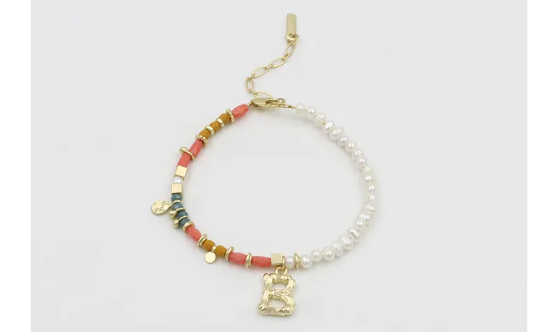 Pulsera con tubos facetados salmón, bolas mostazas