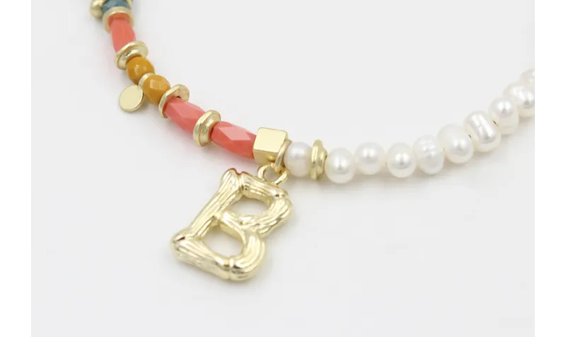 Pulsera con tubos facetados salmón, bolas mostazas