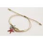 Pulsera hilo fino dorado con nudo serpiente, conch