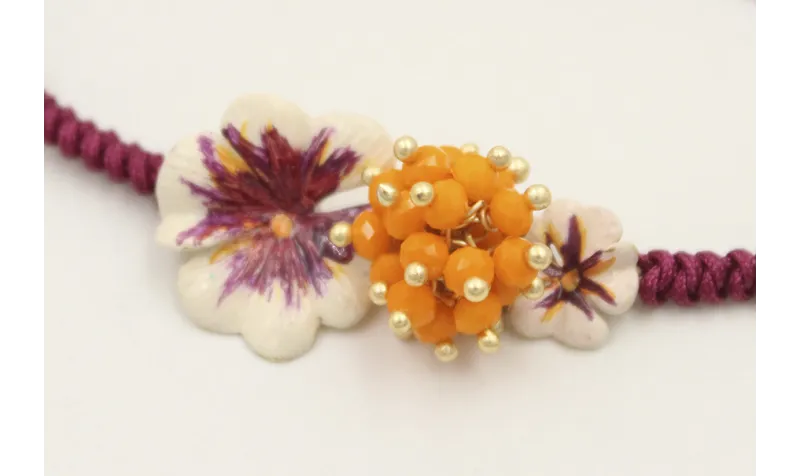 Pulsera hilo granate con nudo serpiente centro tri