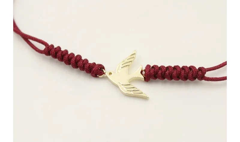 Pulsera hilo color granate con nudo serpiente y go